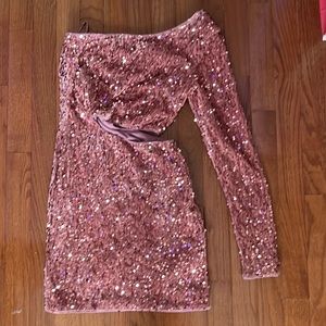 Brand new never worn pink dress with pink sequins. slit on side and one sleeve